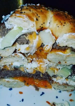 A picture of Everything Bagel Fried Onion Cream cheese Cheddar Cheese Burger.