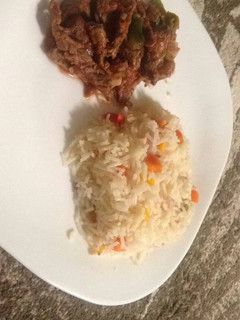A picture of Rice served with Beef.