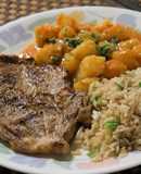 Chuleta con papas bravas y arroz frito