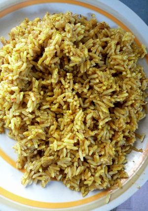 A picture of Red oil Rice and blendered scent leave.