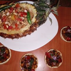 Thai pineapple rice 🍍🍚🍅 A picture of Thai pineapple rice 🍍🍚🍅.