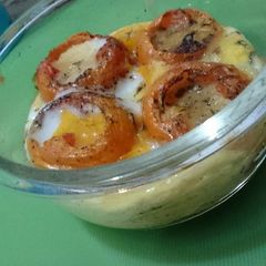 A picture of Baked Tomatoes and Eggs.