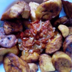 Fried plantain with stew A picture of Fried plantain with stew.