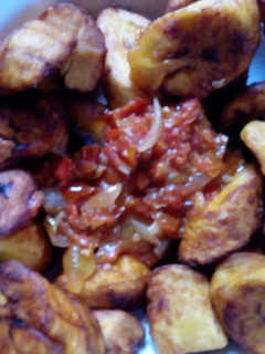 A picture of Fried plantain with stew.