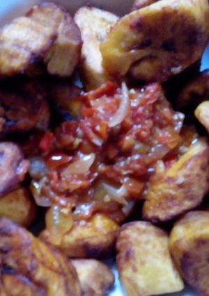 A picture of Fried plantain with stew.