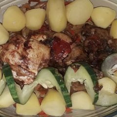 A picture of Grilled chicken nd boiled potato with veggies.