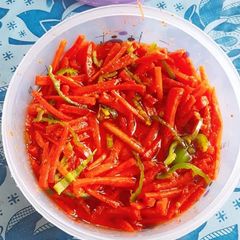 A picture of Gajar ki raiti (gajar ka achar) 🥕🥣.