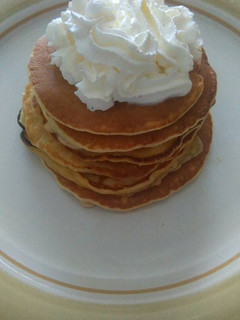 Una foto de Tortitas americanas con nata