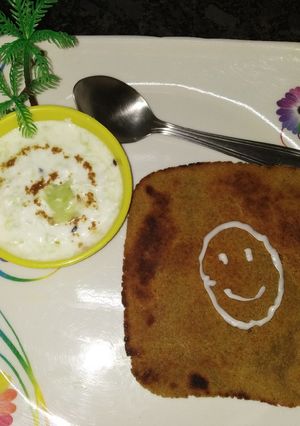 A picture of Oats paratha with cucumber raita.