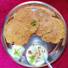 A picture of Aloo Rosti with kheera curd.