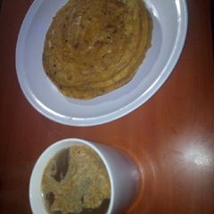 A picture of Pancakes with white Coffee☕.