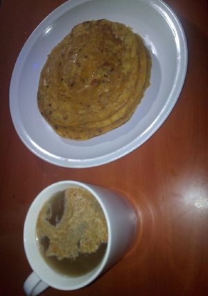 A picture of Pancakes with white Coffee☕.