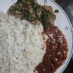 Coconut rice, fry chicken and ground nut soup A picture of Coconut rice, fry chicken and ground nut soup.