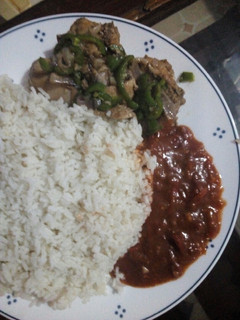 A picture of Coconut rice, fry chicken and ground nut soup.