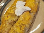 A picture of shredded chicken with green chiles