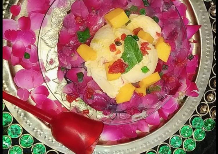 Mango tutti frutti ice cream in rose petals icebowl