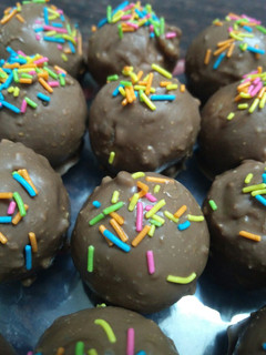 A picture of Dry fruit coconut chocolate balls.