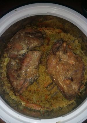 A picture of Cus cus with pried chicken.