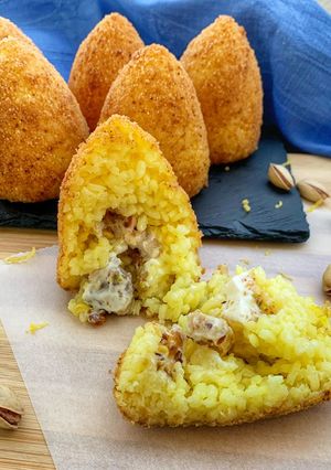 A picture of Arancini with Swordfish, Pistachio, and Bergamot Zest (Lactose-Free and Gluten-Free).