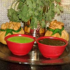 Potli samosa with curd n corriander chutneys A picture of Potli samosa with curd n corriander chutneys.