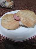 Montadito de panceta y salchichas