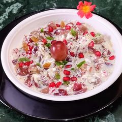 A picture of Fruits Salad with Whipped Cream.