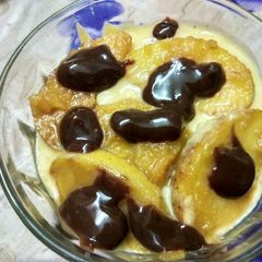 A picture of Apple pudding with carmalised apple and hot chocolate sauce.