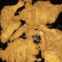 A picture of Chicken Roasted in cooking Range.