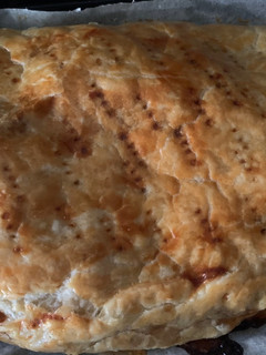 Una foto de Empanada de queso de Cabra y cebolla caramelizada
