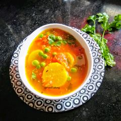 A picture of Radishes, Tomatoes In Sweet And Tangy Gravy | Mula Tomato Khatta.
