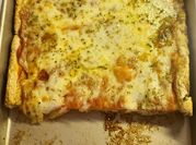 A picture of pizza dough with baking powder