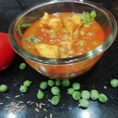 A picture of Matar Paneer in tomato puree.