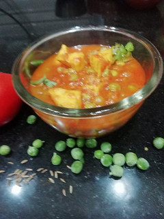 A picture of Matar Paneer in tomato puree.