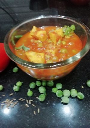 A picture of Matar Paneer in tomato puree.