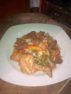 A picture of Sauced chicken and beef.