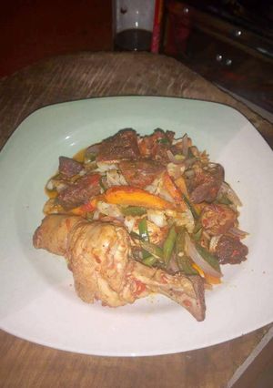 A picture of Sauced chicken and beef.