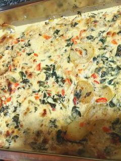 Una foto de Merluza al horno con verduras