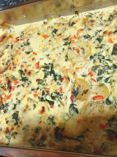 Una foto de Merluza al horno con verduras