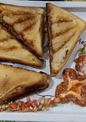 A picture of Schezwan Veg grilled sandwich.