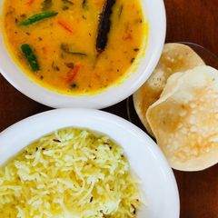 A picture of Dal Tadka with Yellow Rice.