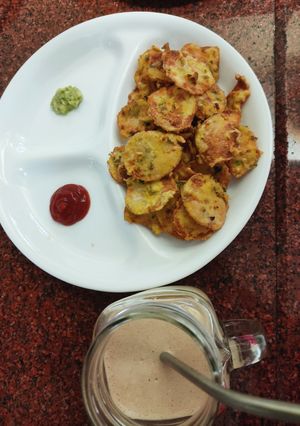 A picture of Maaru fritters with tomato carrot salsa.