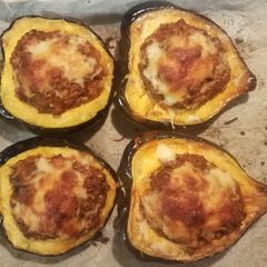 A picture of Acorn Squash stuffed with turkey sausage.
