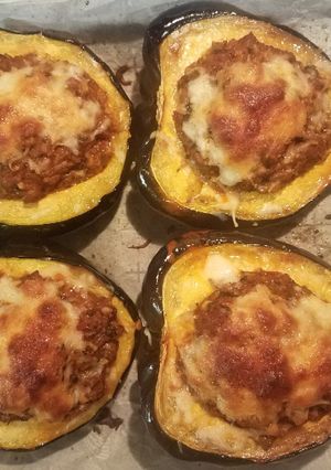 A picture of Acorn Squash stuffed with turkey sausage.
