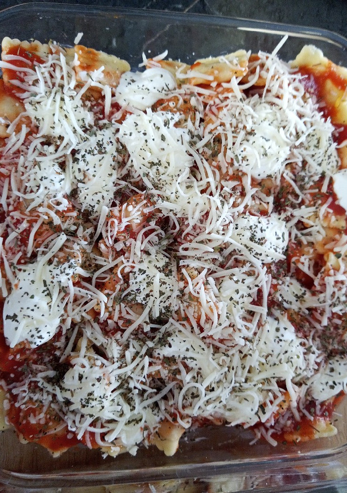 Una foto de Ravioli relleno de 🧀 con salsa de tomate 🍅