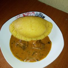 A picture of Eba pie and Ogbonor soup.