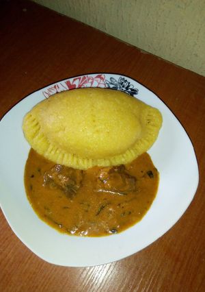 A picture of Eba pie and Ogbonor soup.