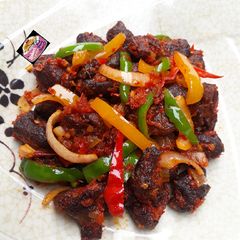A picture of Asun (spicy roasted goat meat).