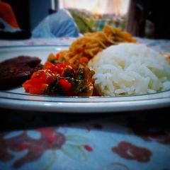 White rice and spaghetti with fried beef and vegetable sauce A picture of White rice and spaghetti with fried beef and vegetable sauce.
