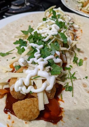 A picture of Quick and easy chicken and gouchang Tortilla wrap.