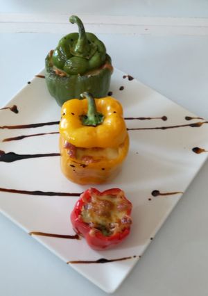 A picture of Stuffed bell peppers with leftovers.